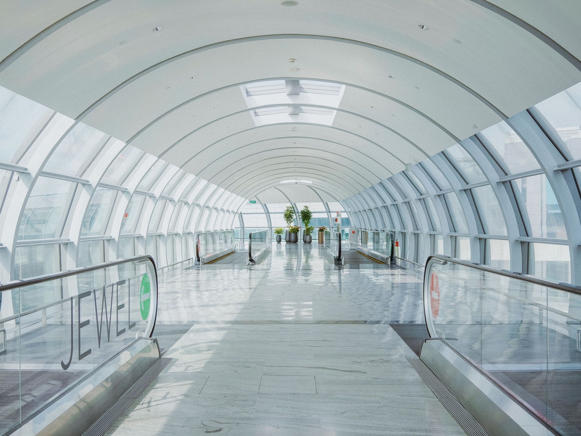 Escalators in empty tunnel at airport