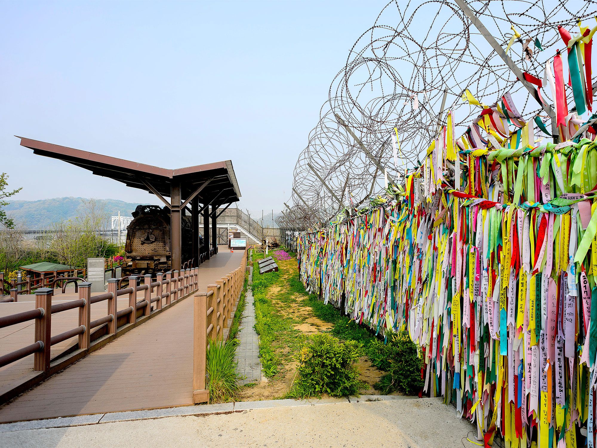 Barbed wire and colorful fencing in the Korean Demilitarized Zone (DMZ)