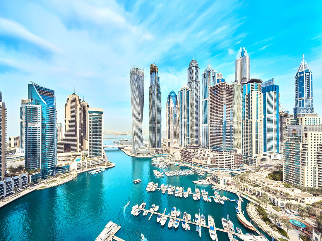 Modern skyscrapers flanking marina in Dubai, United Arab Emirates