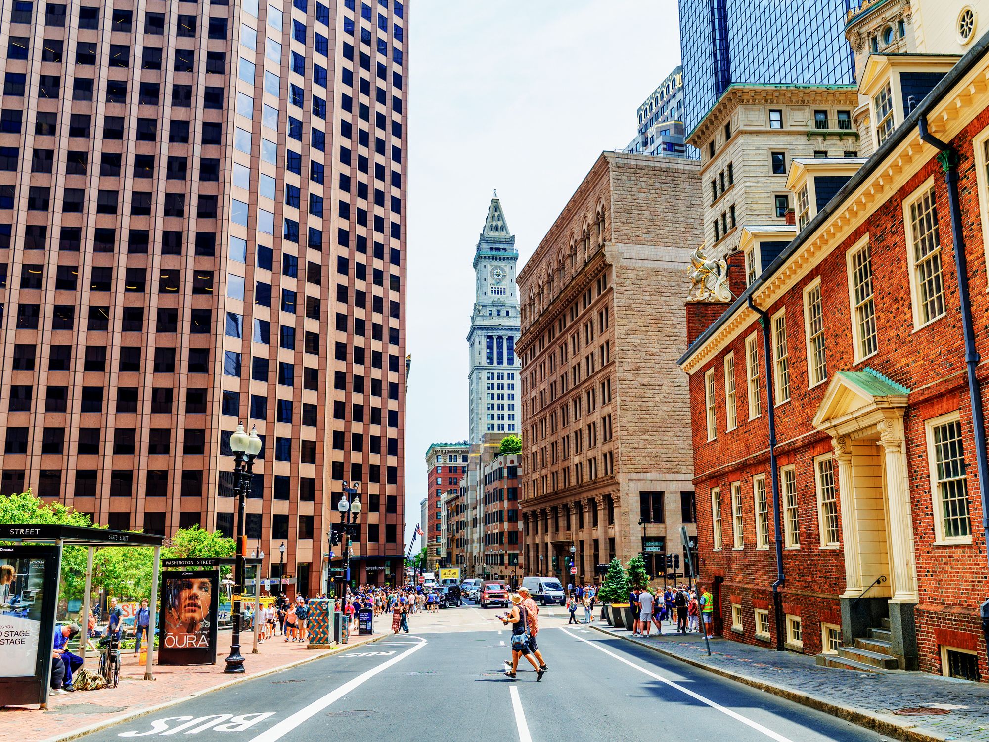 Couple crossing street in downtown Boston