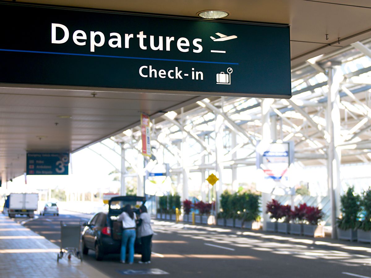 Curbside sign for departures and check-in at airport