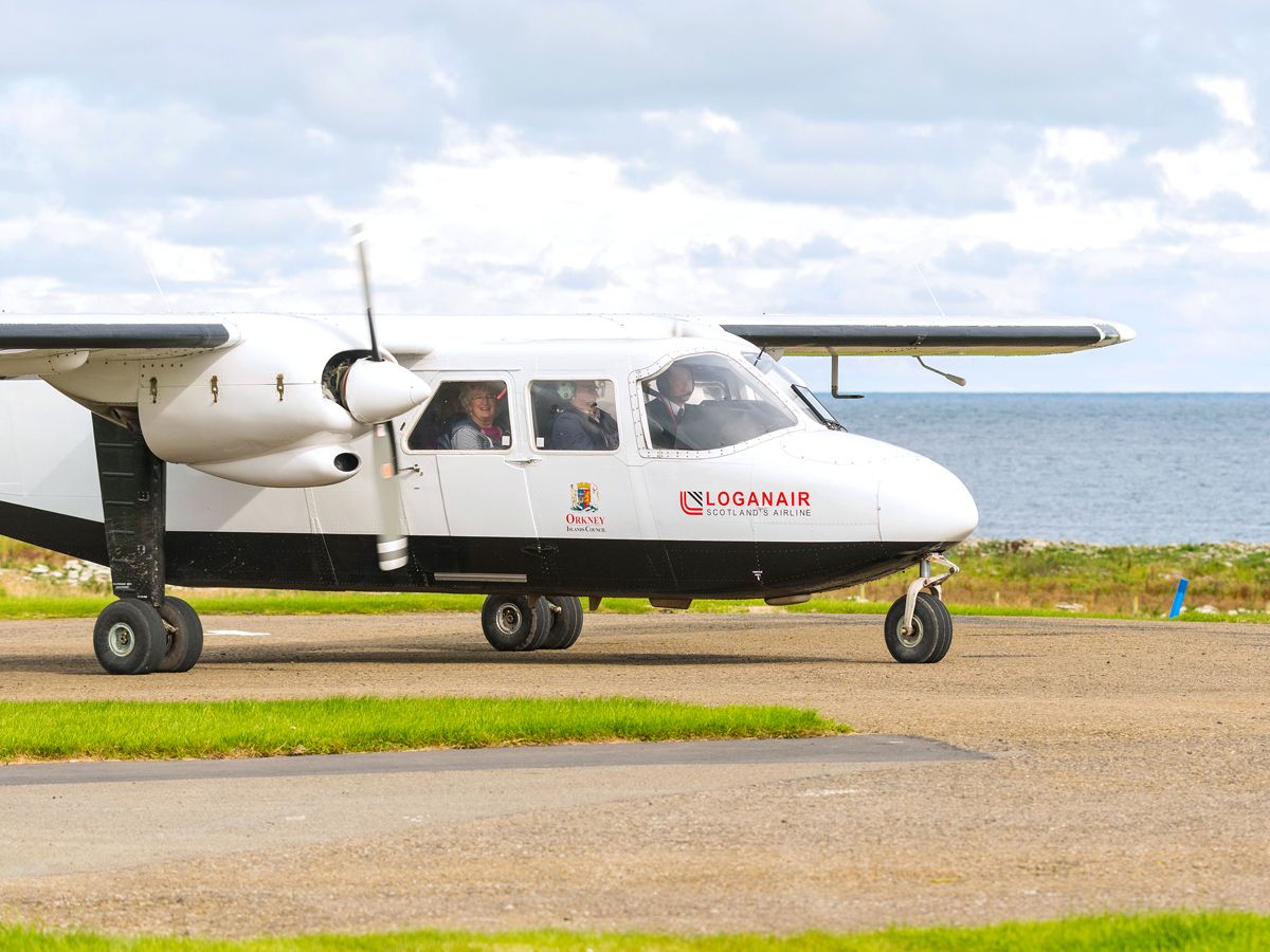 Loganair aircraft taxiing at Westray Airport in Scotland