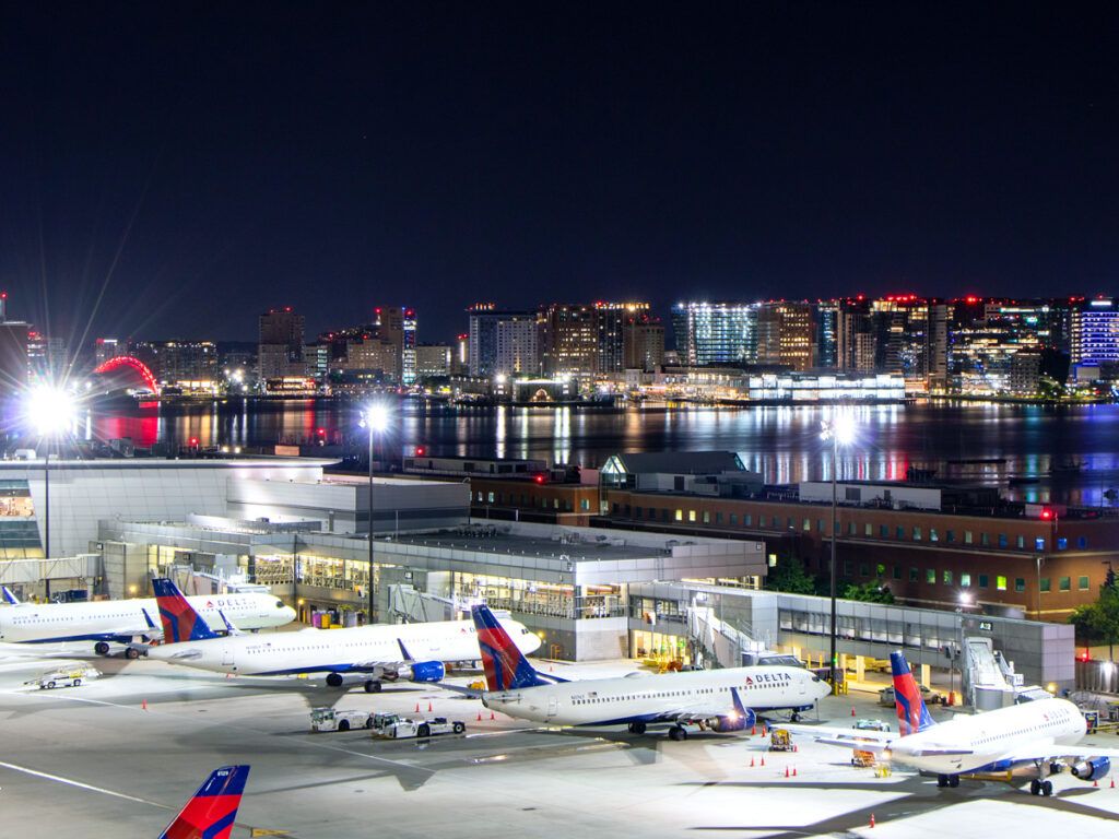 Delta aircraft parked at Boston Logan Airport at night