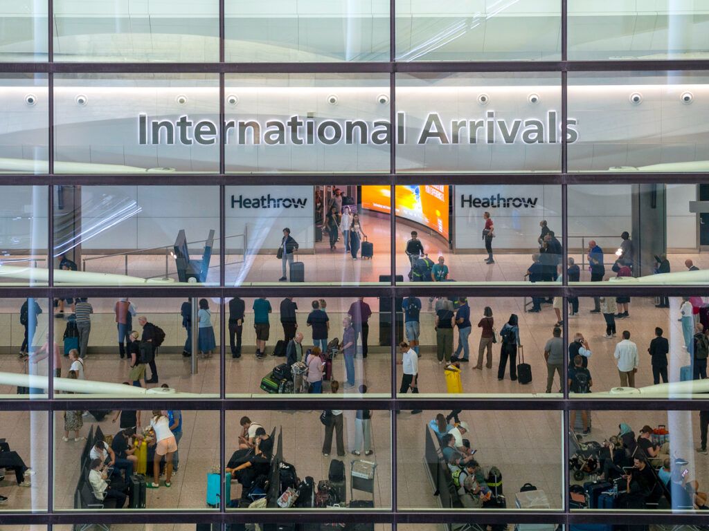 Busy arrivals area at Heathrow Airport