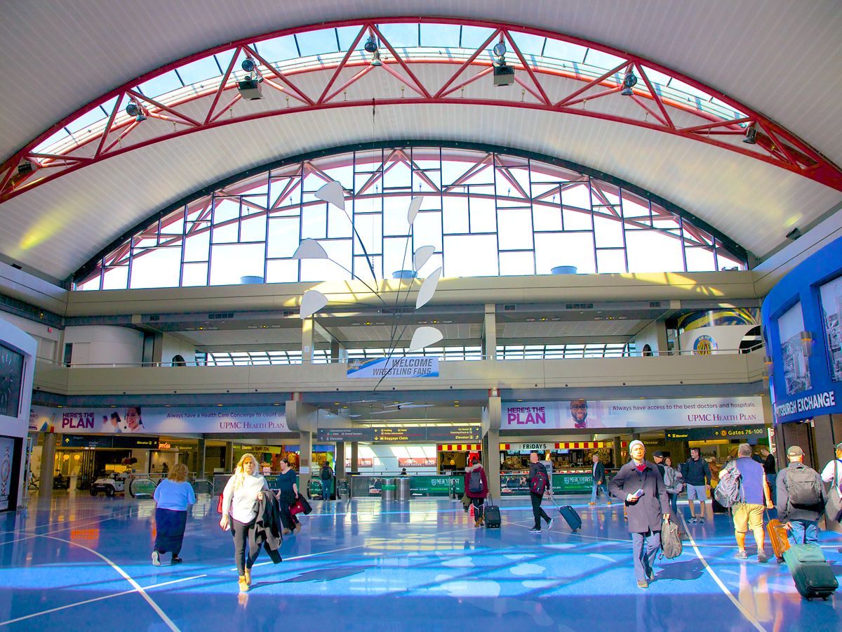 Passengers walking through terminal at Pittsburgh International Airport