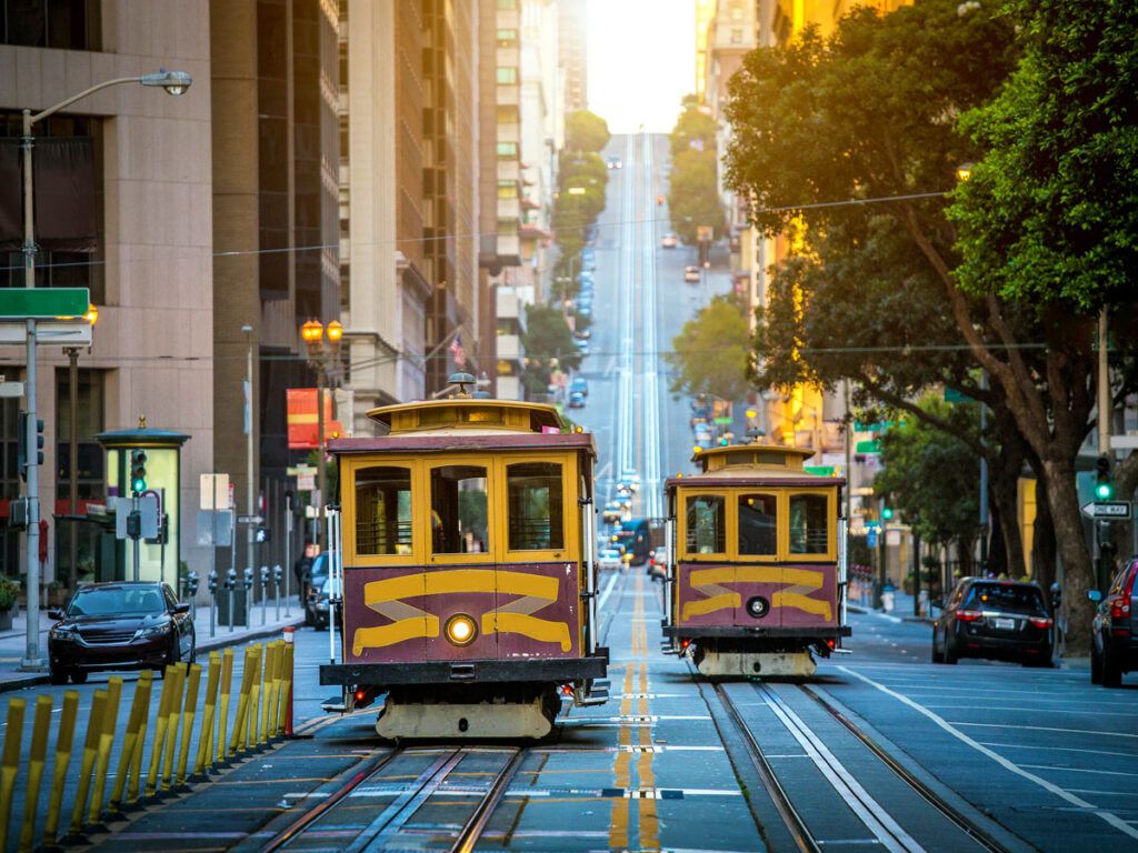 Cable cars on hilly San Francisco street