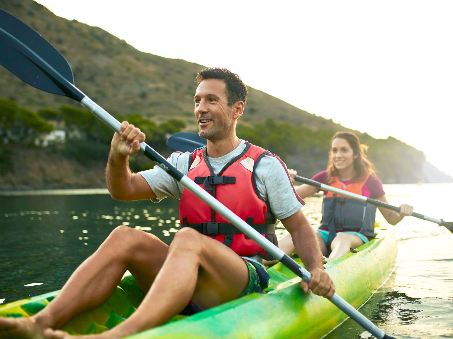 Couple kayaking on lake