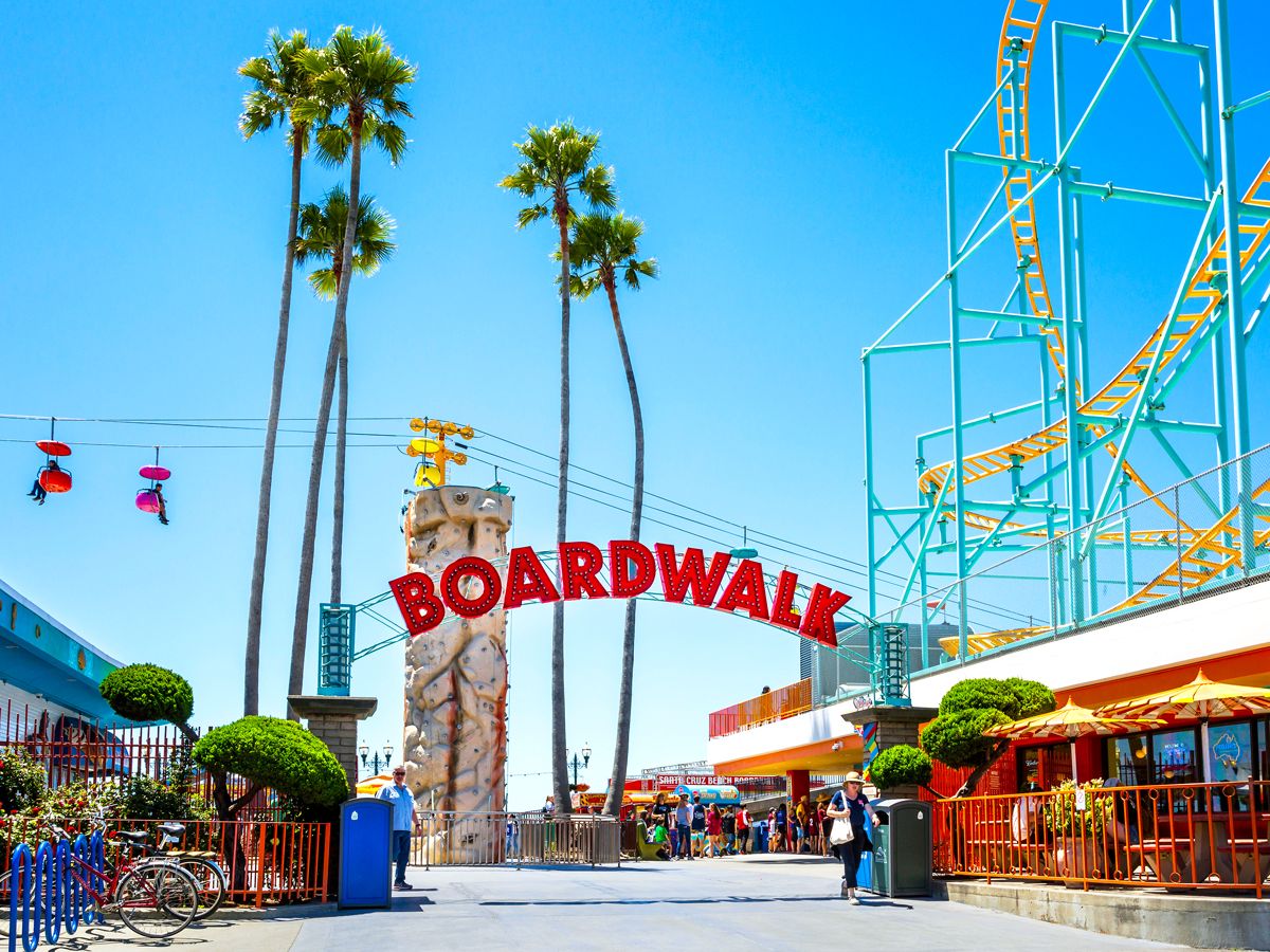 Entrance to Santa Cruz Beach Boardwalk with amusement park rides
