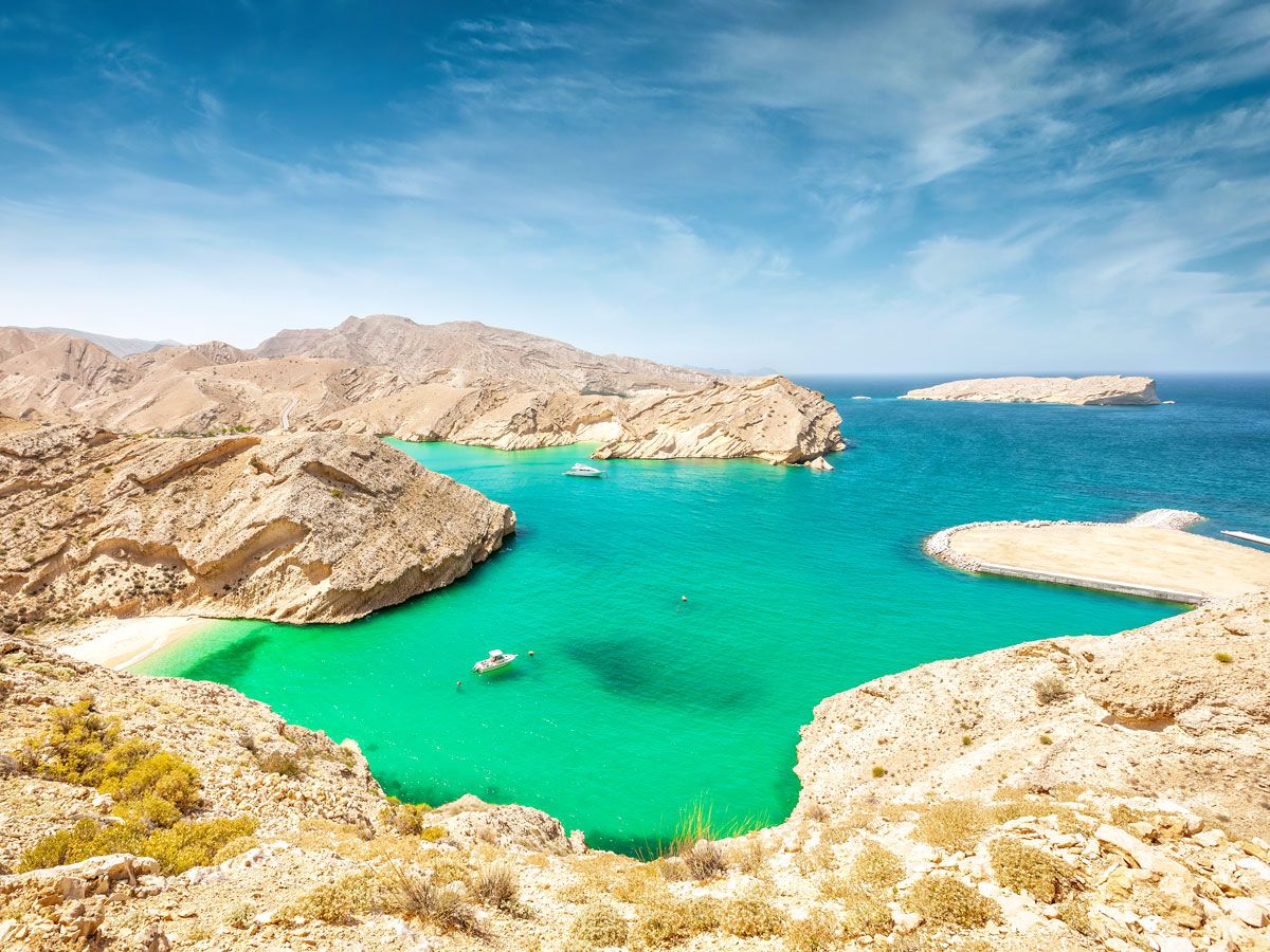 Boat in turquoise waters of the Sargasso Sea, seen from above
