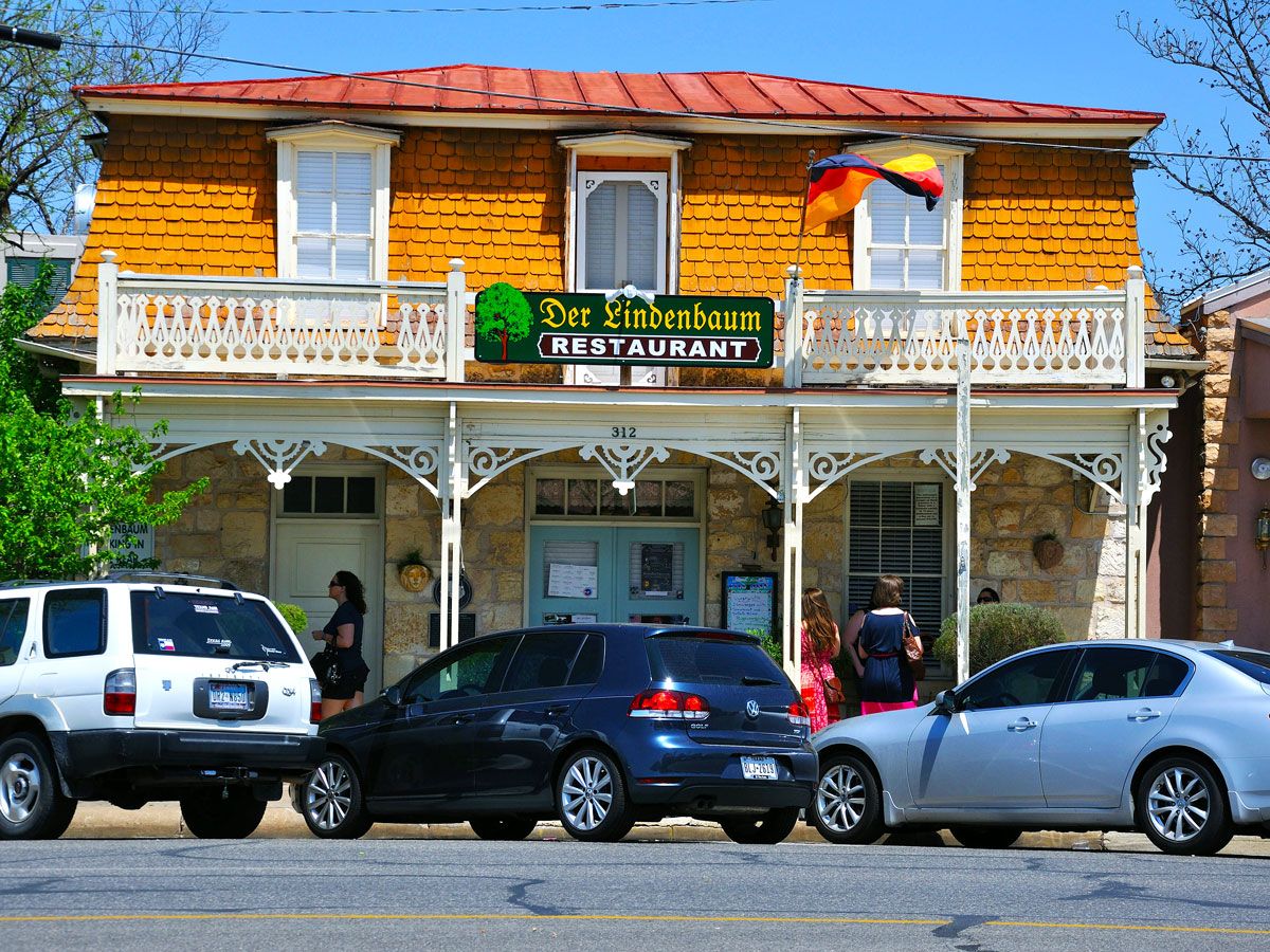 Cars parked outside restaurant in Fredericksburg, Texas