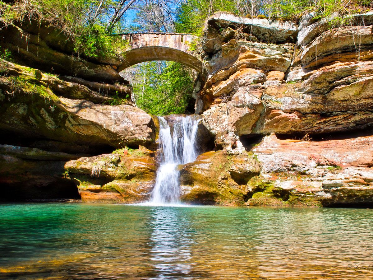 Footbridge over waterfall in Hocking Hills State Park in Ohio