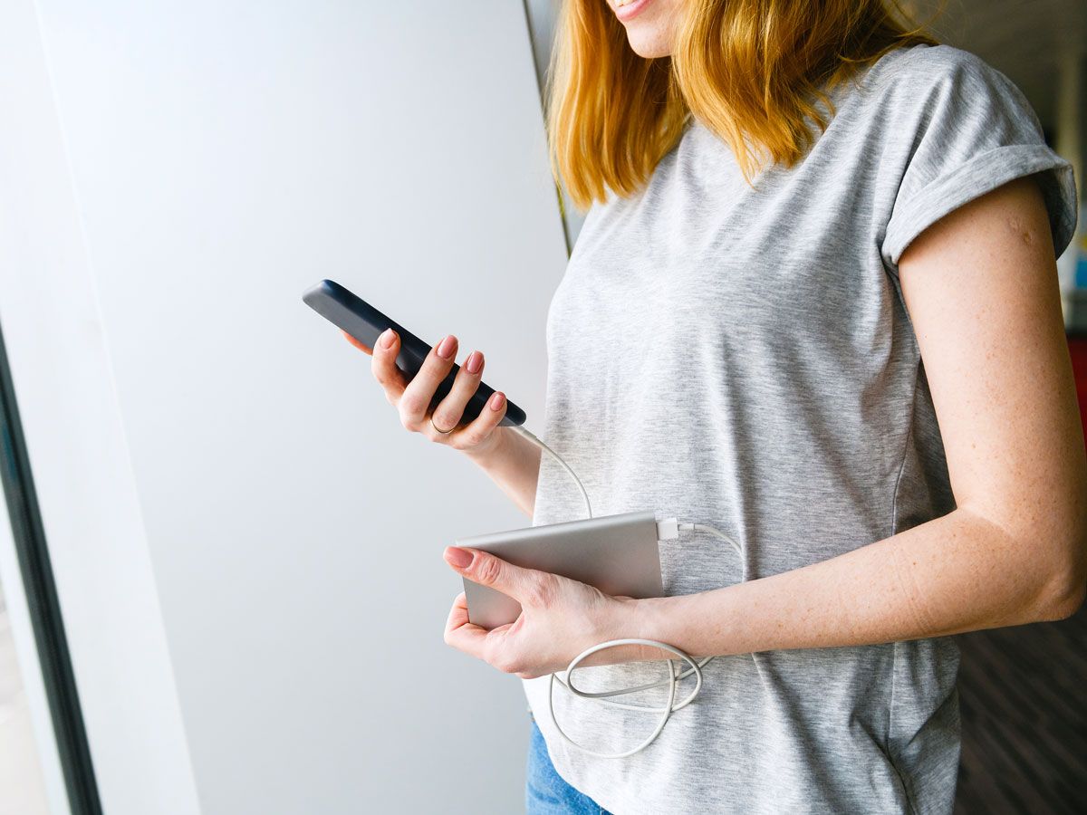 Person using portable charging device