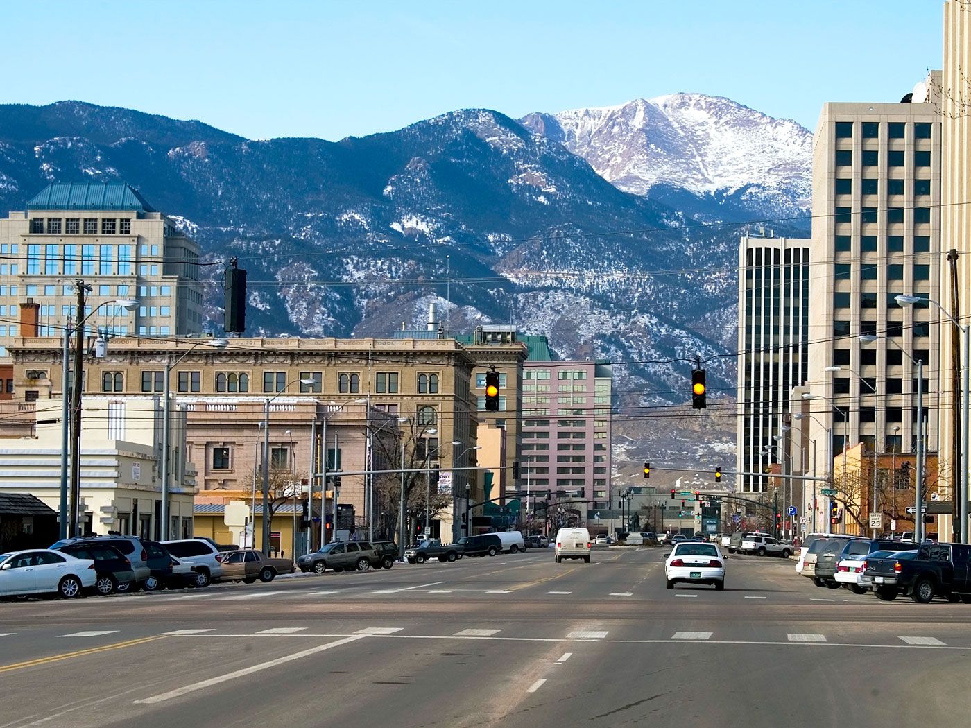 Street in Colorado Springs, Colorado, with mountains in background