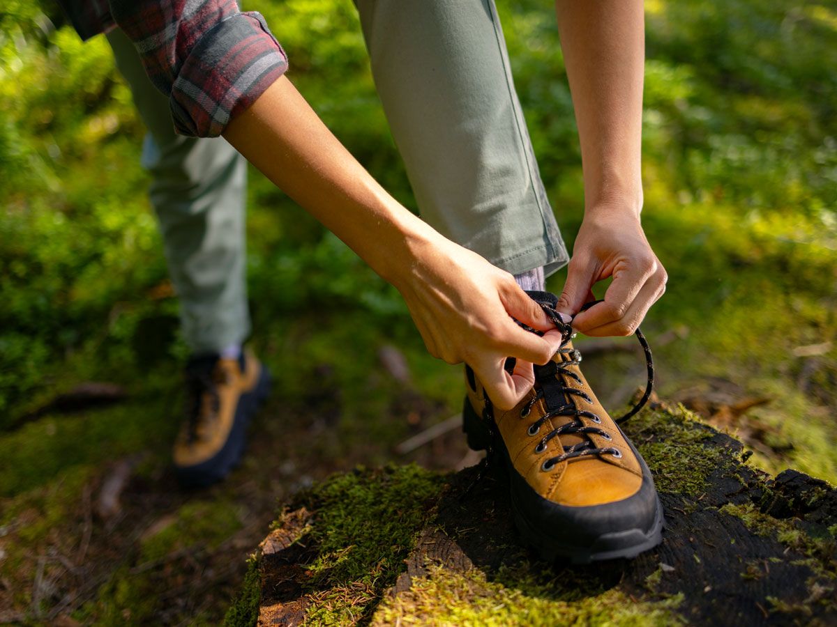 Person tying shoes