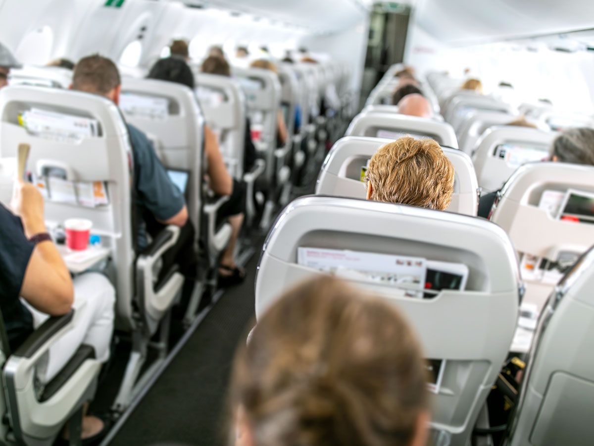 View of aircraft cabin from back to front