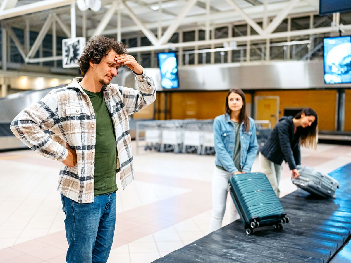 Frustrated passenger waiting at baggage claim