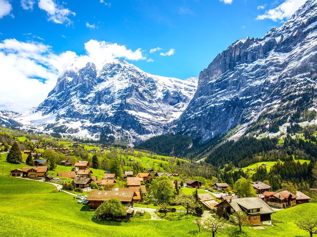 Swiss village of Grindelwald surrounded by snow-capped Alps