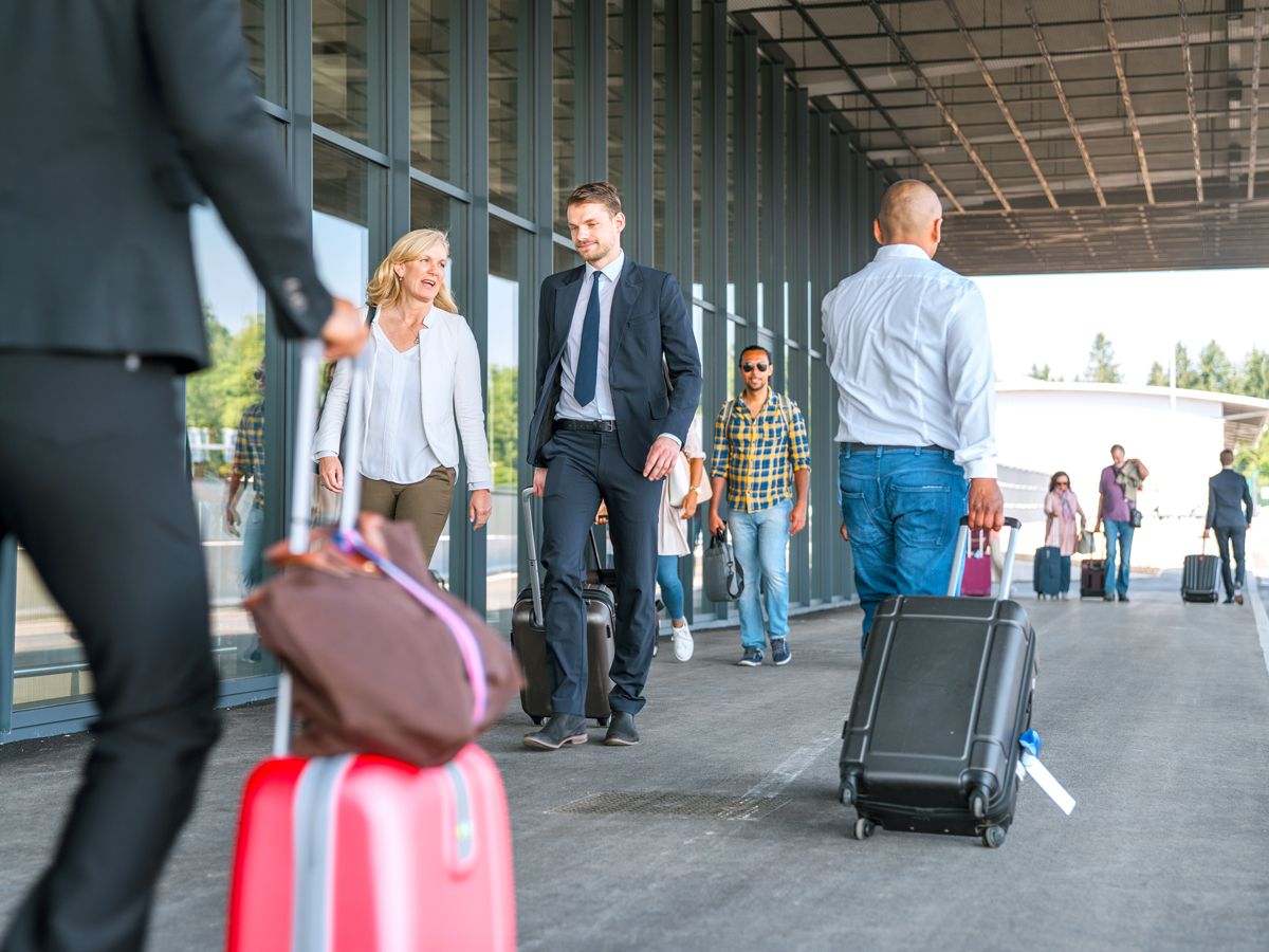 Passengers outside airport terminal