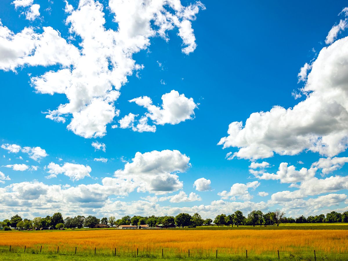 Oklahoma farm under partly cloudy skies