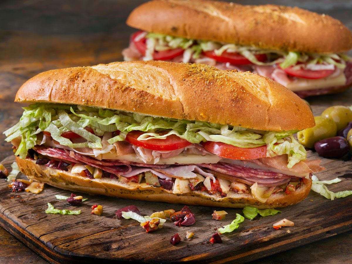 A muffaletta sandwich on a cutting board