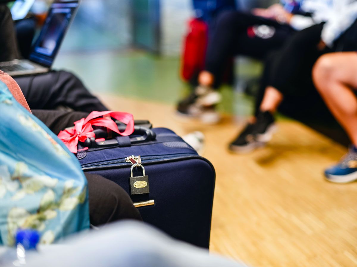 Luggage with red bow to distinguish it