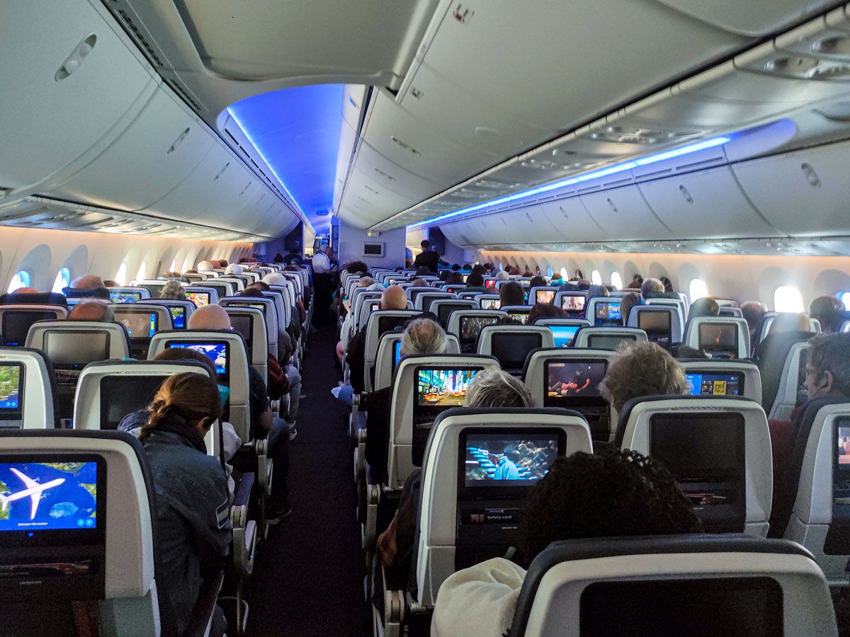 View of United Airlines Boeing 787 economy-class cabin from back to front