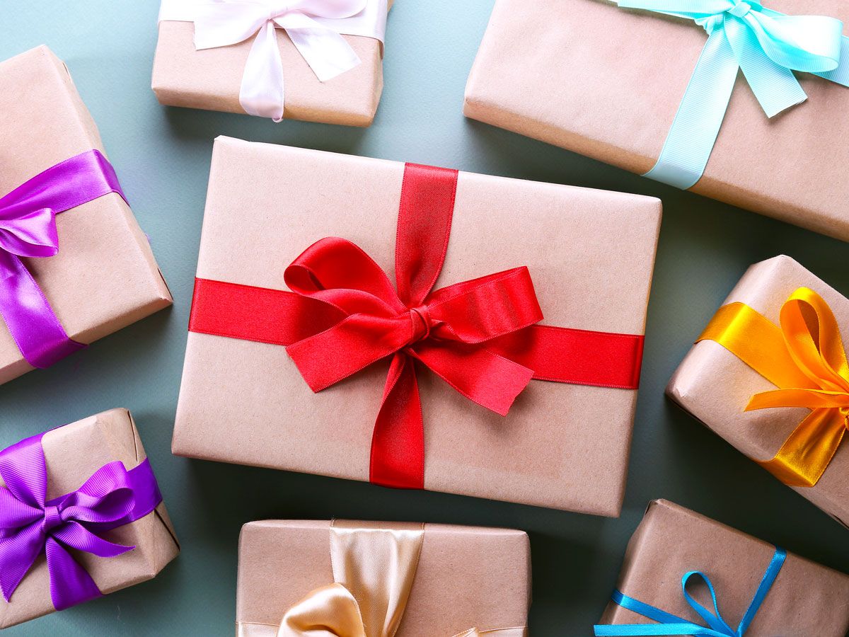 Gifts wrapped with bows sitting on table