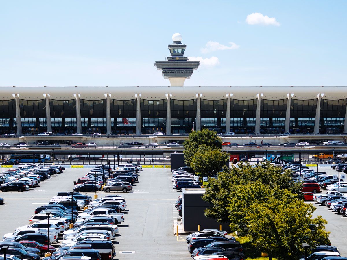 Parking area, main terminal building, and control tower at Washington Dulles Airport in Virginia