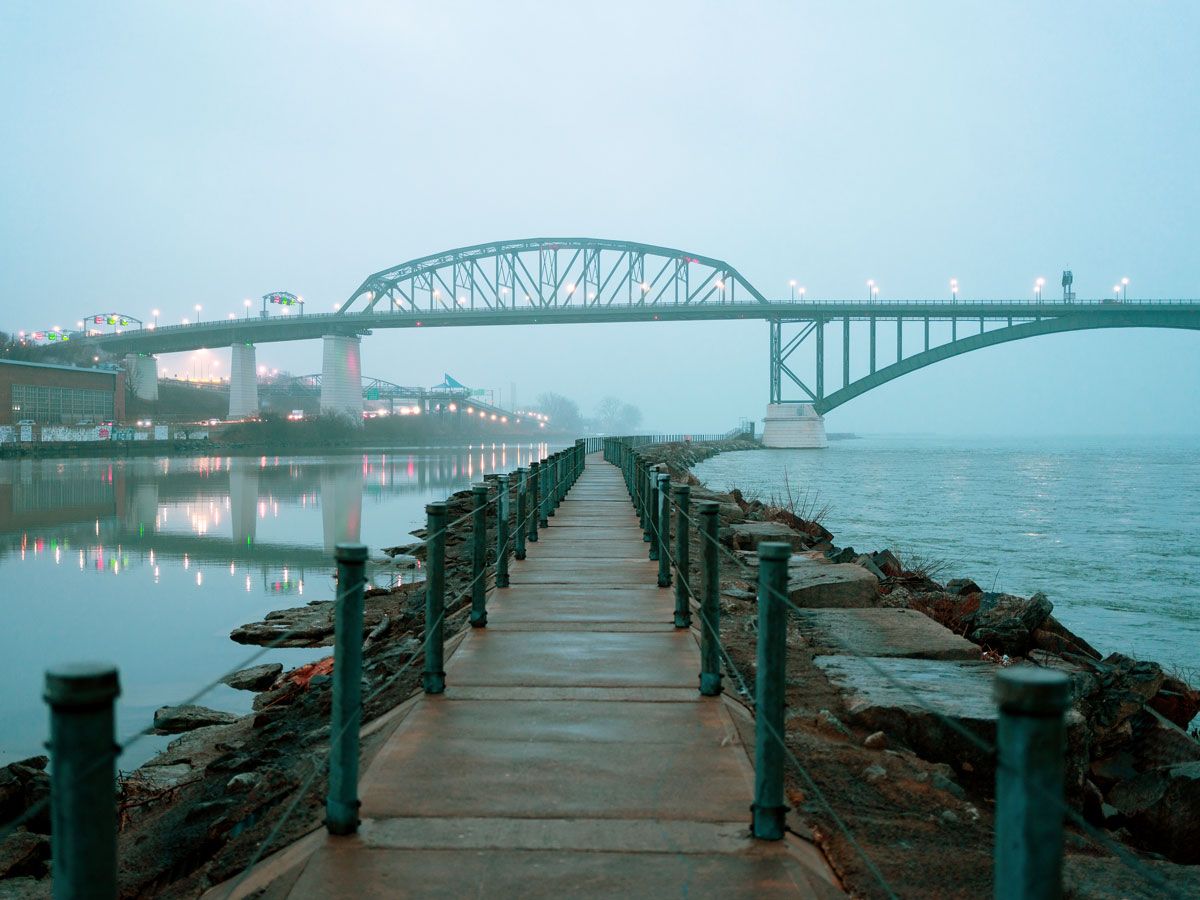 Waterfront path and bridge under cloudy skies in Buffalo, New York