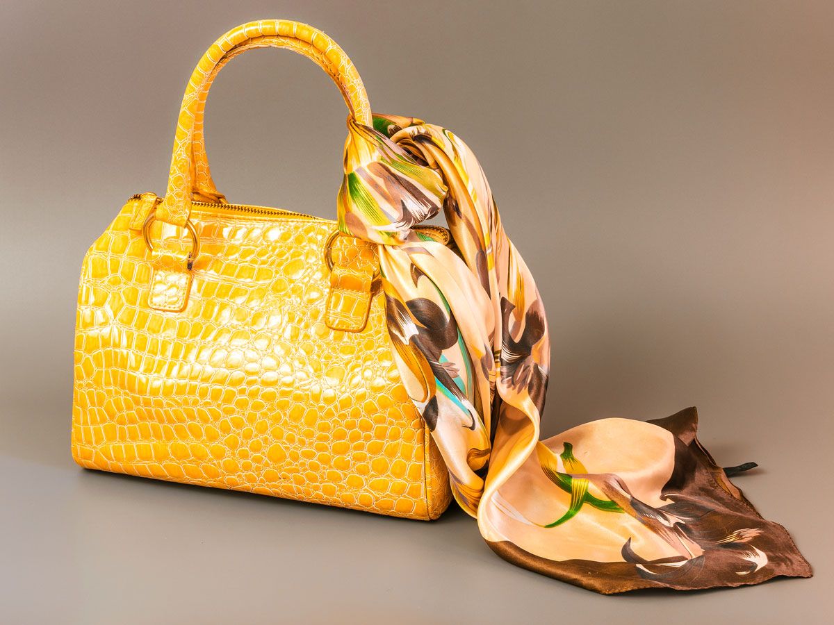 Scarfed tied to yellow purse