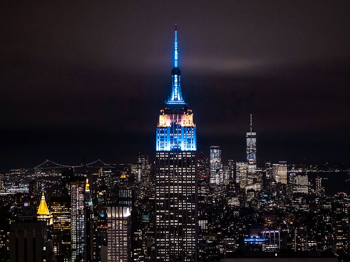 Empire State Building and Manhattan skyline illuminated at night