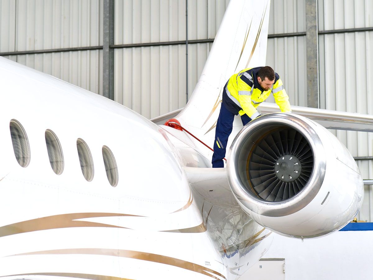 Mechanic inspecting aircraft engine