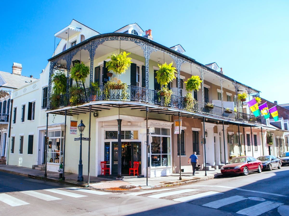 Two-story building with wrought-iron balcony in New Orleans