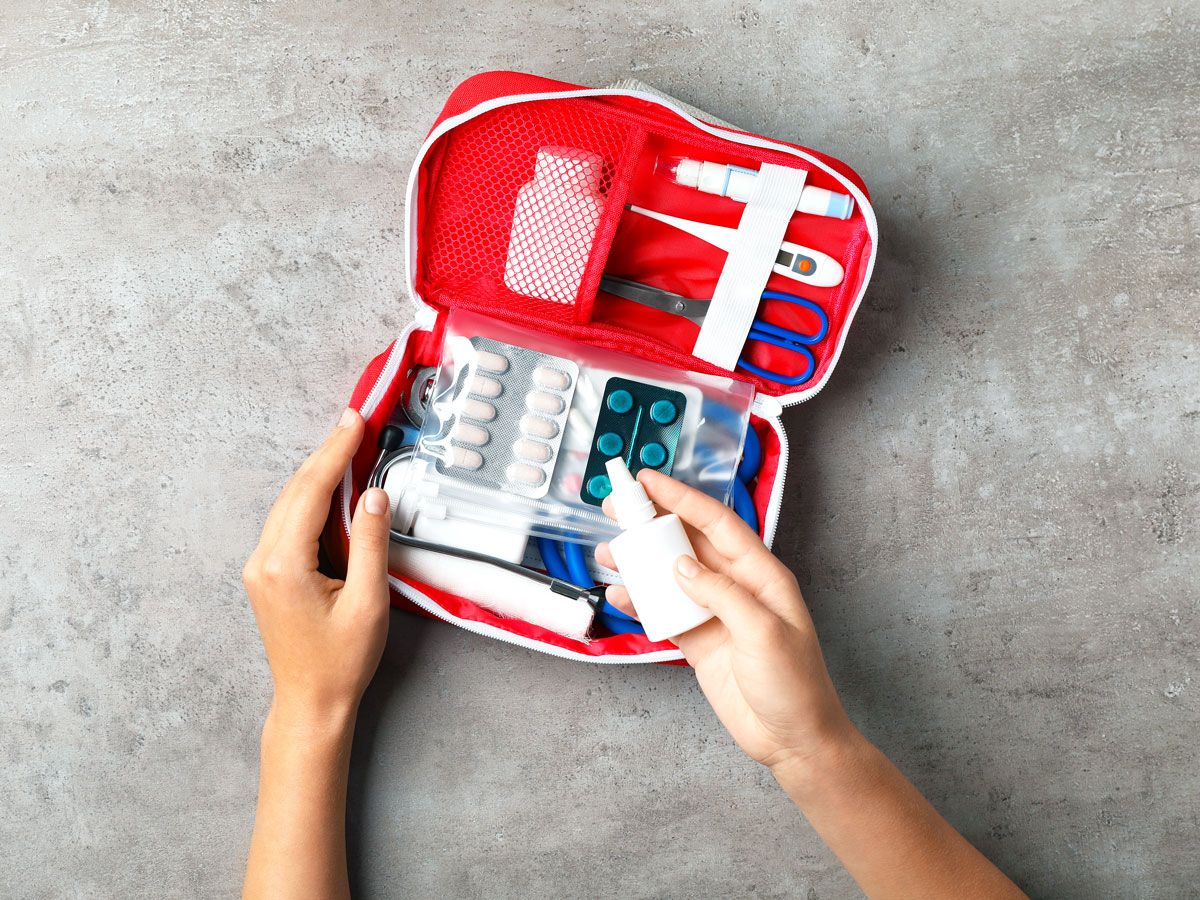 Person using first-aid kit