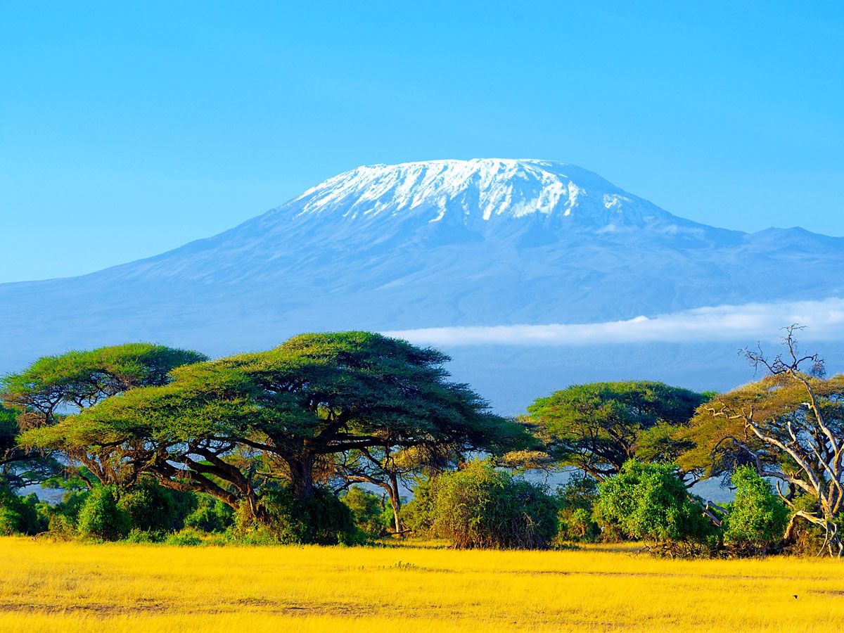 Mount Kilimanjaro rising above plains of Tanzania 