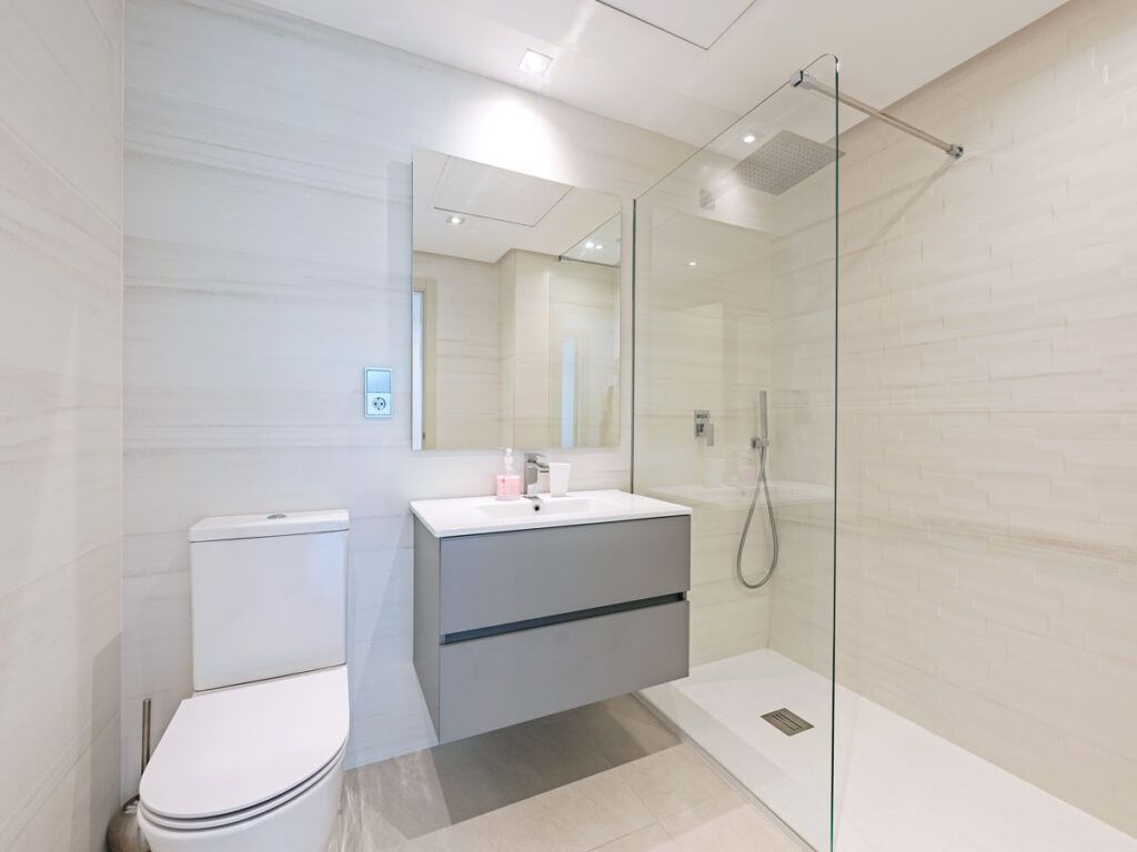 Hotel bathroom with half-glass shower door