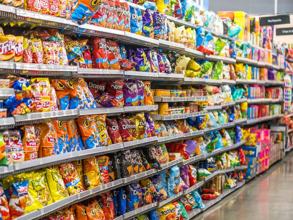 Packaged snack foods in grocery store aisle