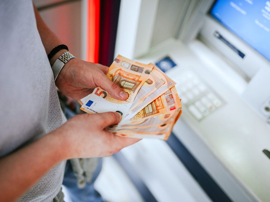 Person holding euros