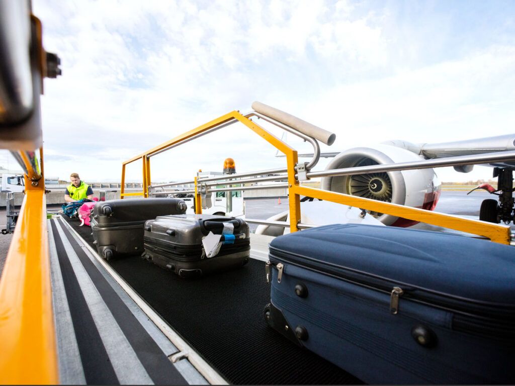 Luggage being loaded onto airplane