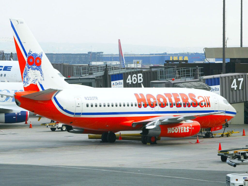 Hooters Air Boeing 737 parked at gate