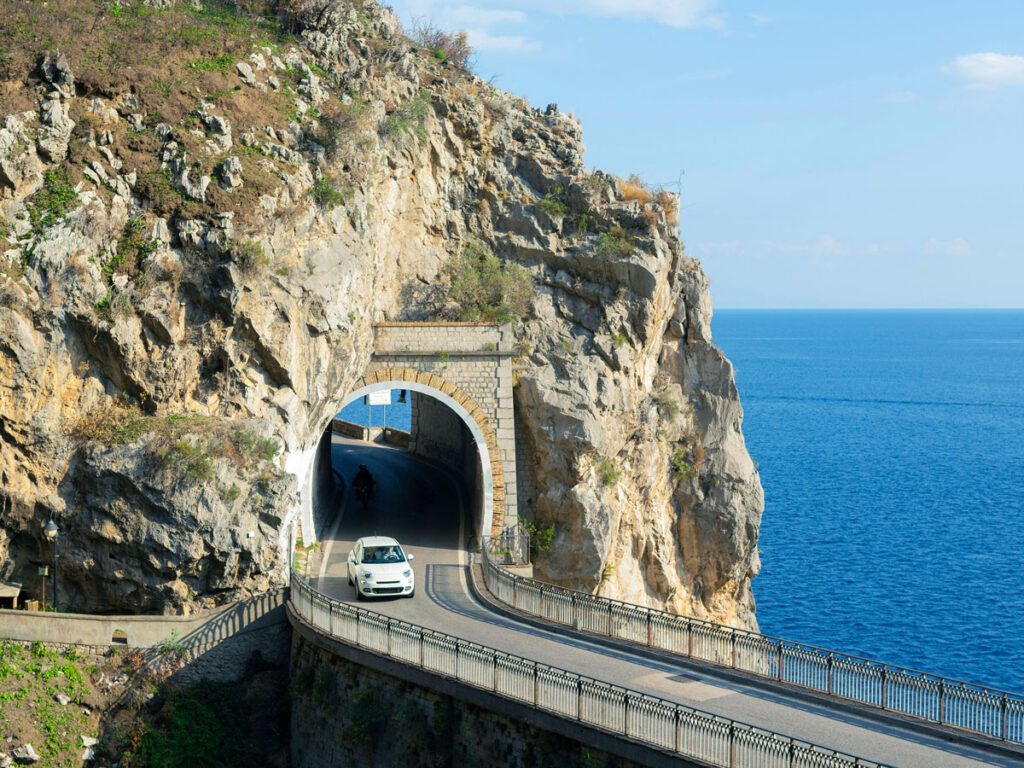 Car driving through tunnel on Italy's Amalfi Coast