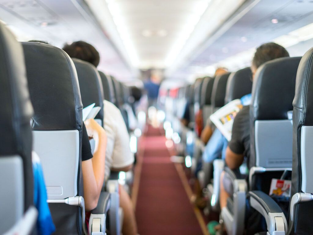 View of airplane cabin from back to front