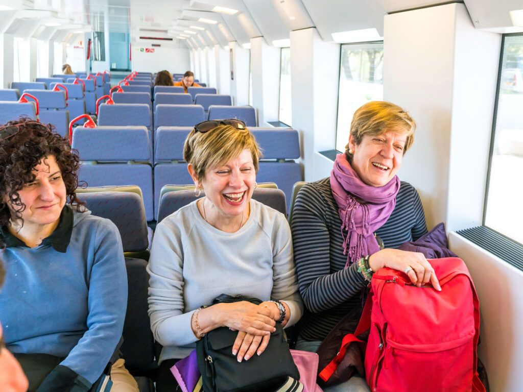 Group of train riders in their seats