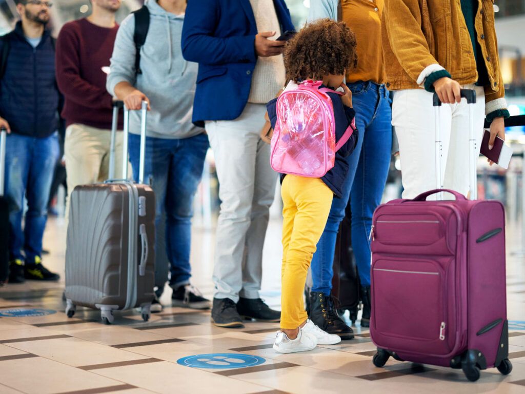Passengers standing in line at airport