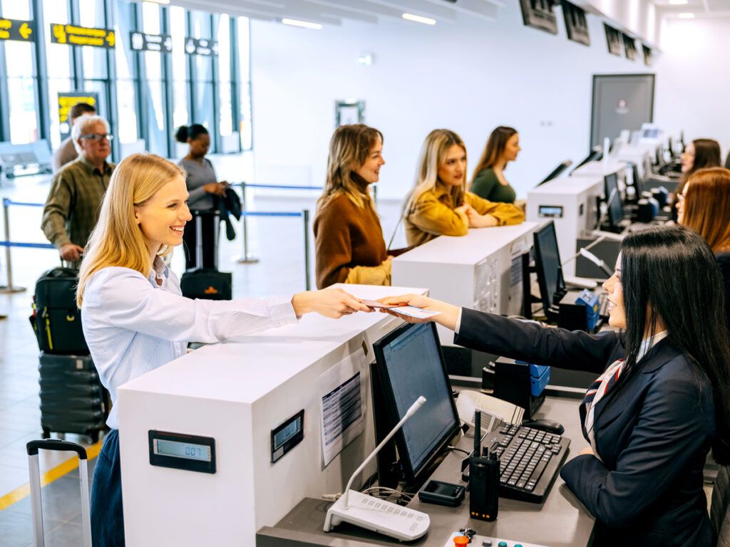 Passengers checking in at airport ticket counter