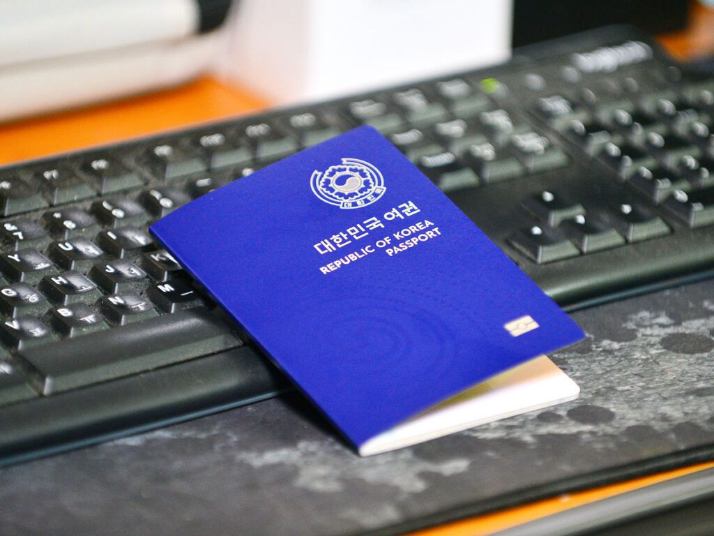 South Korea passport resting on keyboard