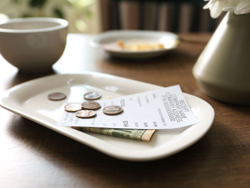 Change and receipt on tray
