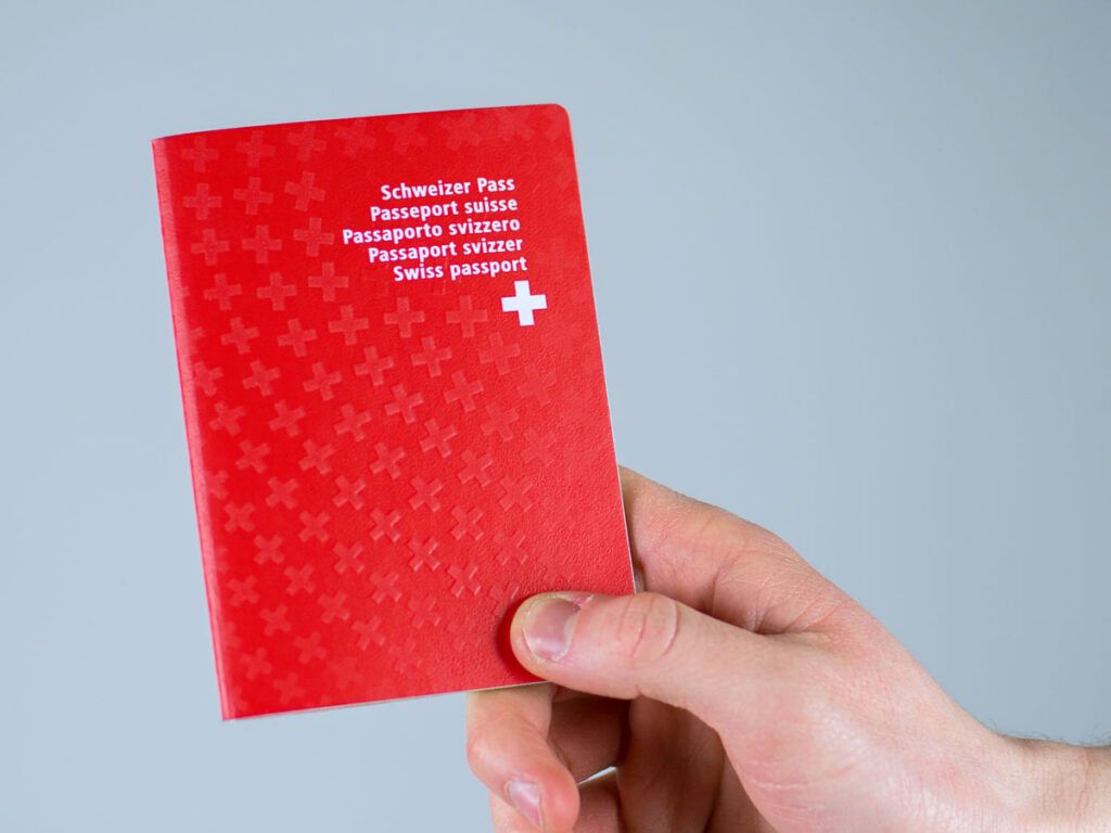 Person holding Switzerland passport