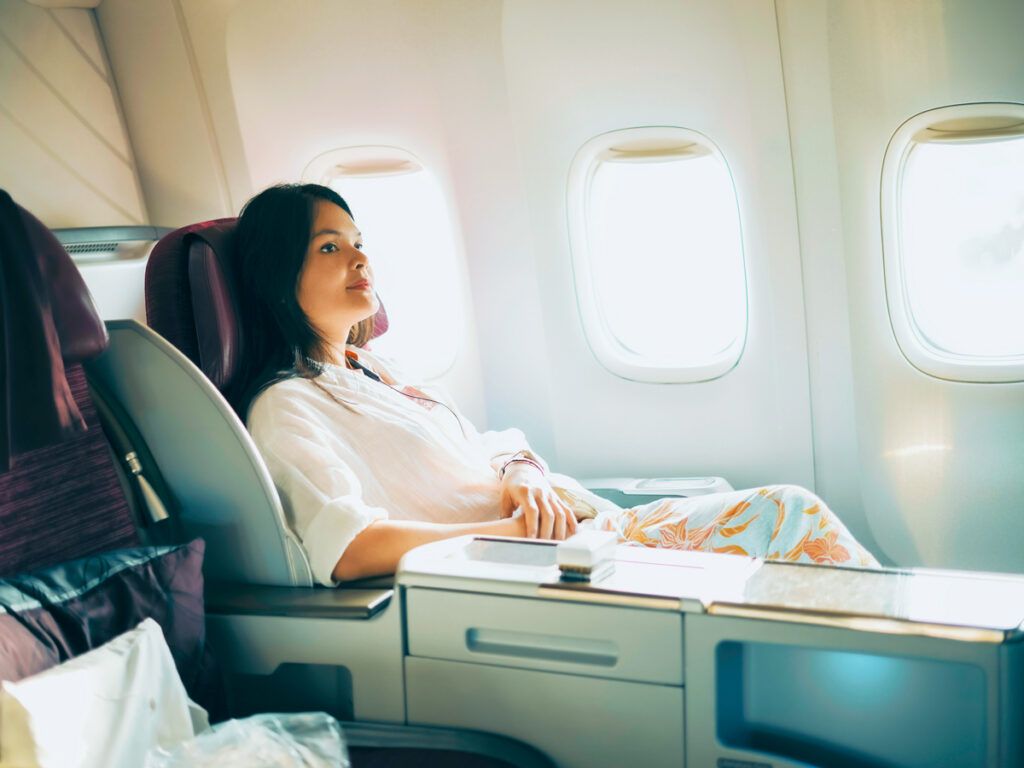 Passenger relaxing in business-class pod