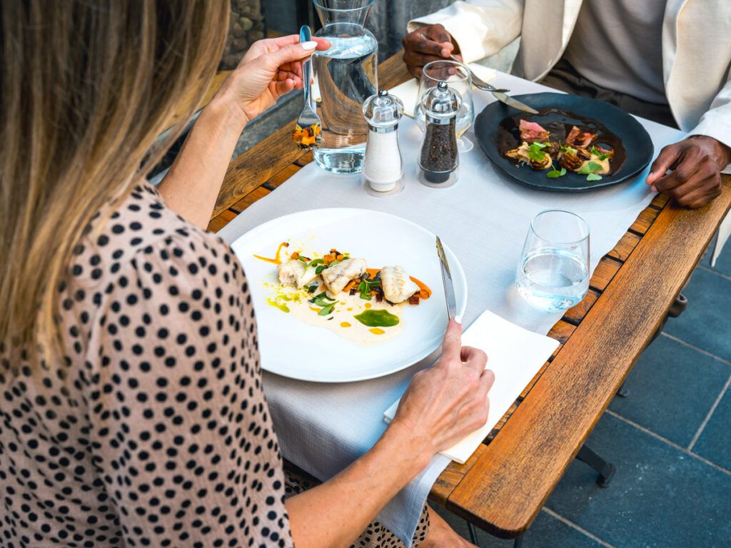 Couple eating meal outside